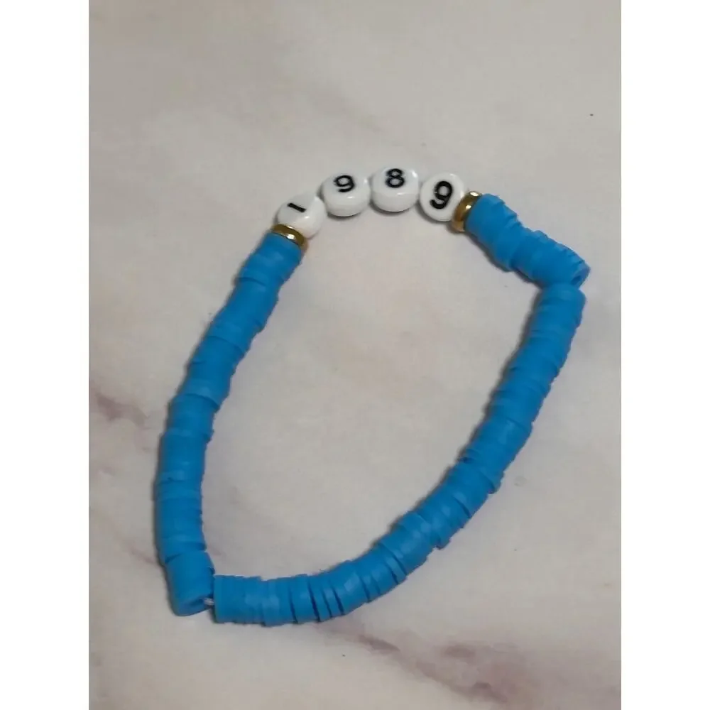 1989 Blue Heishi Word Bracelet 7 Inch Polymer Clay Gold White Letter Beads